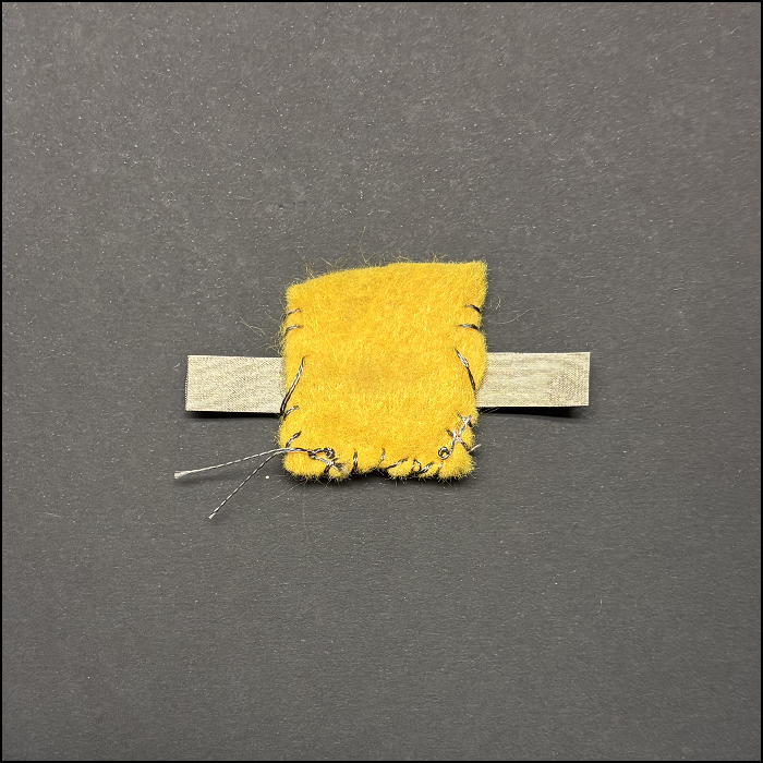 I accidentally sewed using both conductive fabric and conductive thread. I did sew it well so the button wouldn't pop out.