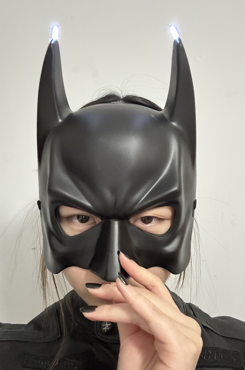 Using copper tape, I followed the series circuit method to light up two LED at the top of the two 'ears'. It creates a glowing effect in the dark, making it a perfect accessory for a Batmancosplay.