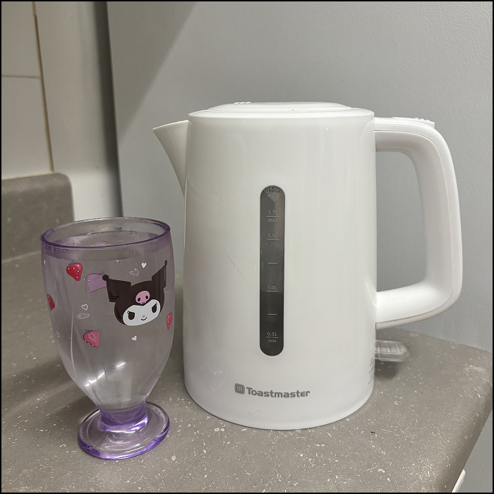 The sound of pouring water into a plastic cup.