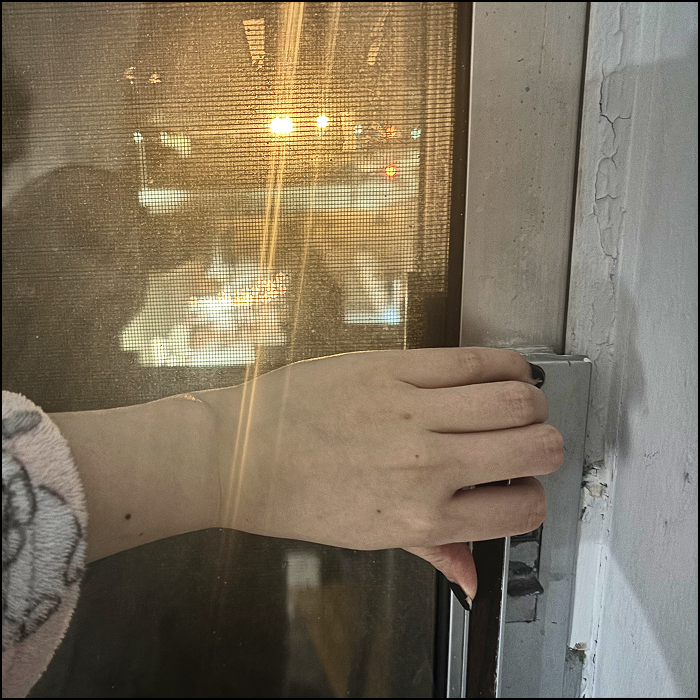 The sound of opening and closing the sliding door. You can slightly hear the sound of traffic outside.