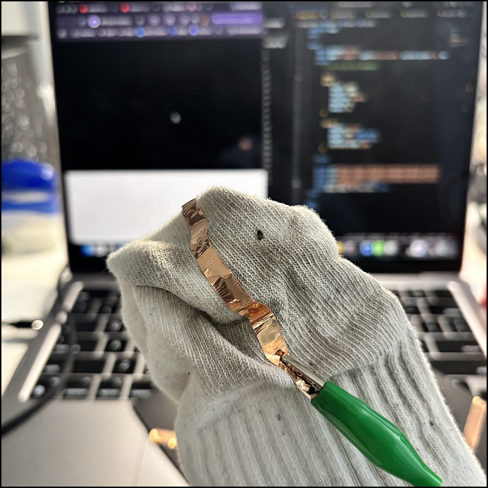 Referencing Steve's tutorial of making physical prototypes, I attached copper tape on a dirty sock. Since the fabric of the sock is thin, the alligator clips easily attach without the use of tape.