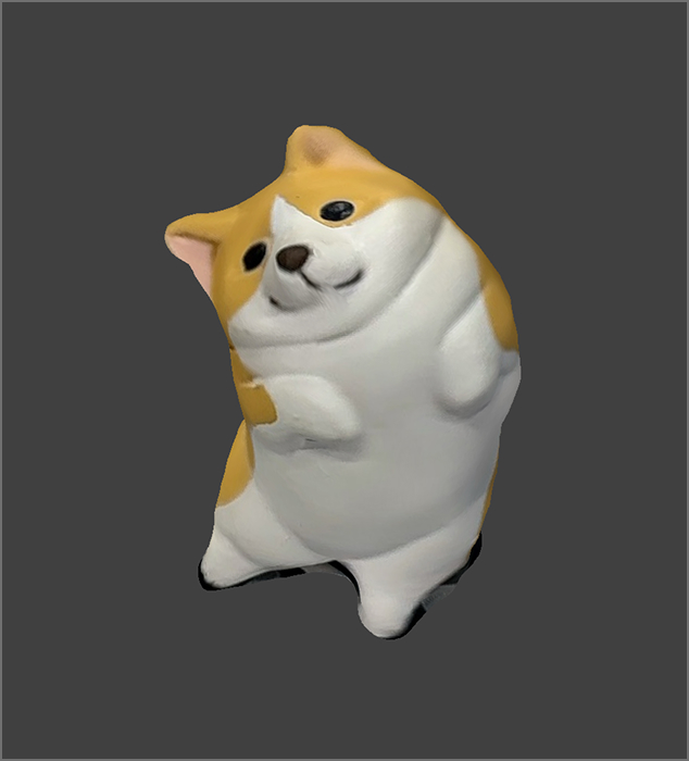 I 3D scanned the sculpture of a corgi. Since I want to get the details of its bottom, I made the object stand up.